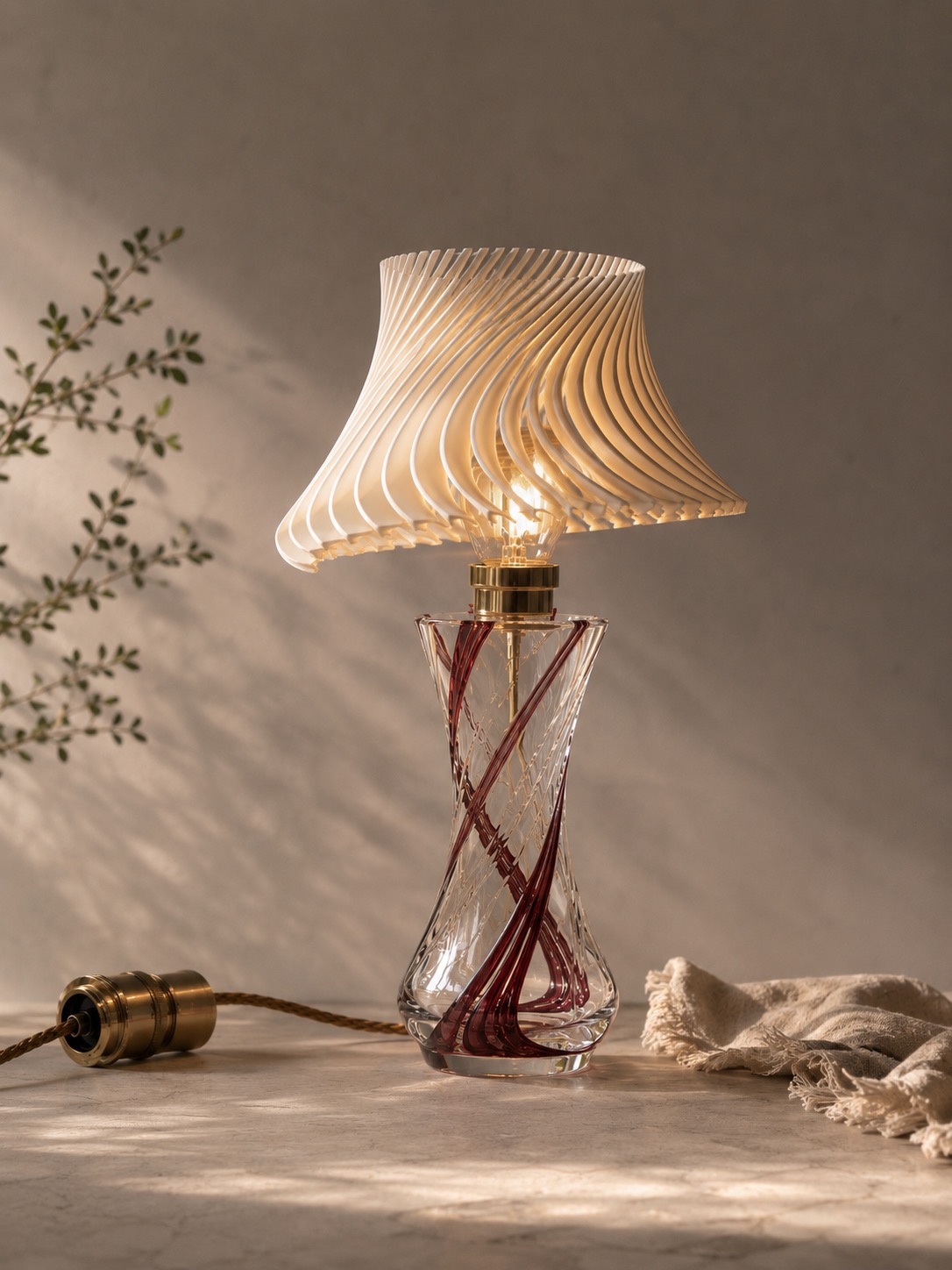 Crystal vase lamp fitted with a 3D-printed shade head during assembly