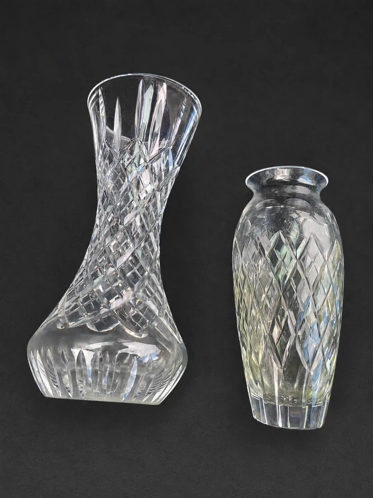 Two cut crystal vases sourced through Facebook Marketplace on a dark background